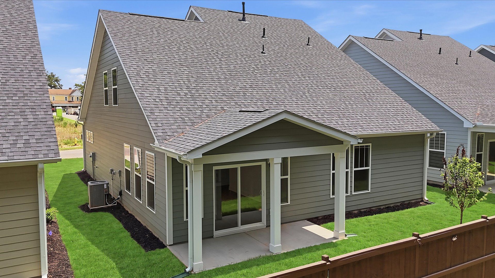 Highly functional rear covered porch adds memorable living space to this elegant home