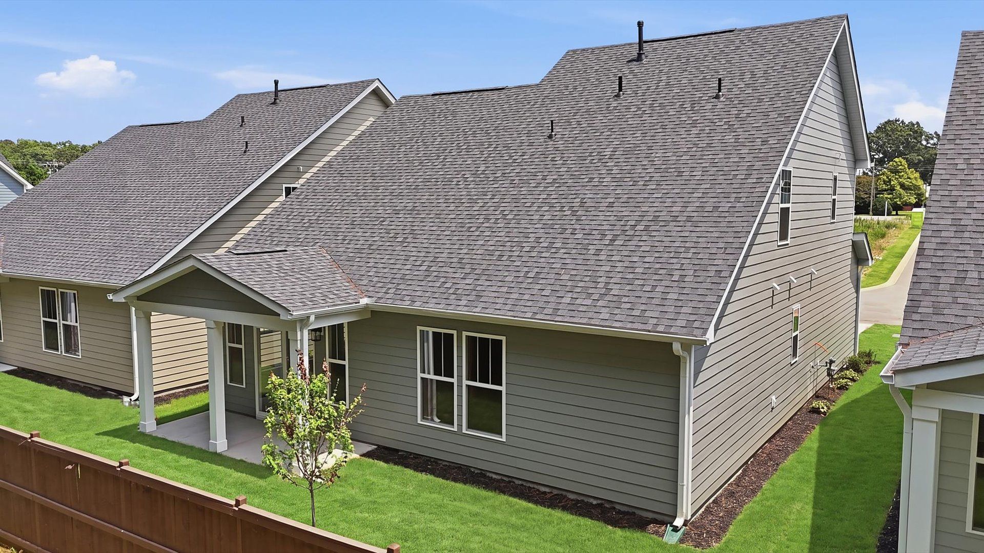 Exceptional outdoor living begins with a covered back porch in this thoughtfully designed home