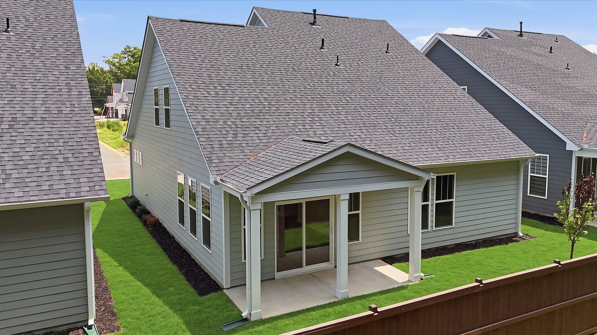 Thoughtfully designed rear exterior featuring a welcoming covered porch