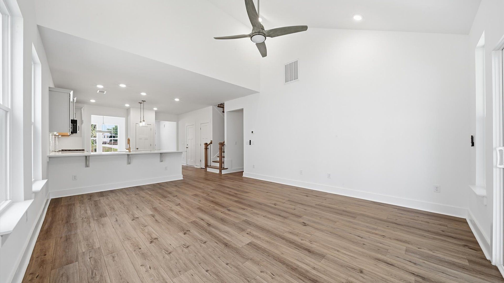First-class living space featuring expansive ceilings, elegant design, and open sightlines to the kitchen