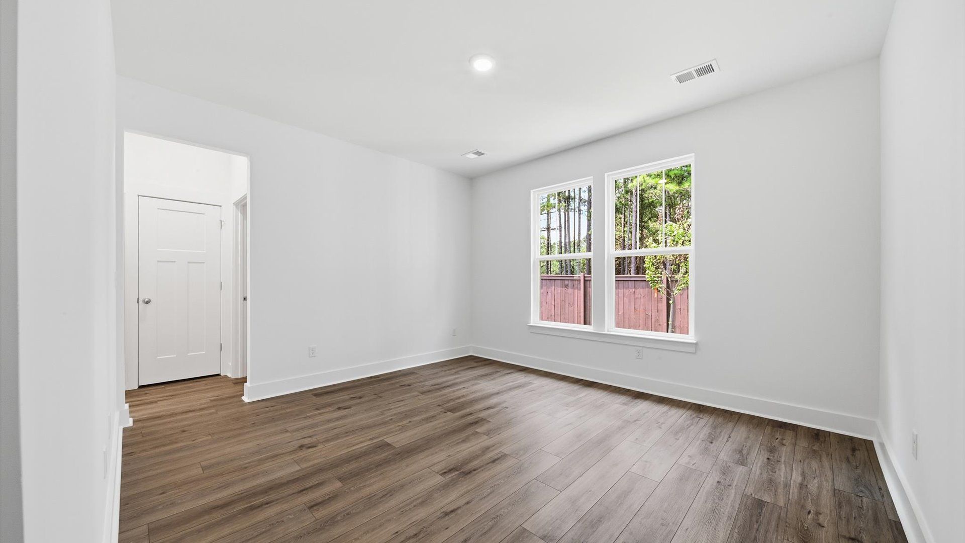 Accomplished design meets restful elegance in this exclusive main level primary suite by DRB Homes