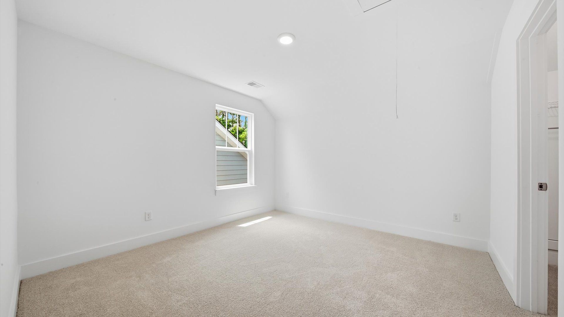 Superior comfort in a secondary bedroom with plush carpet and an oversized walk-in closet