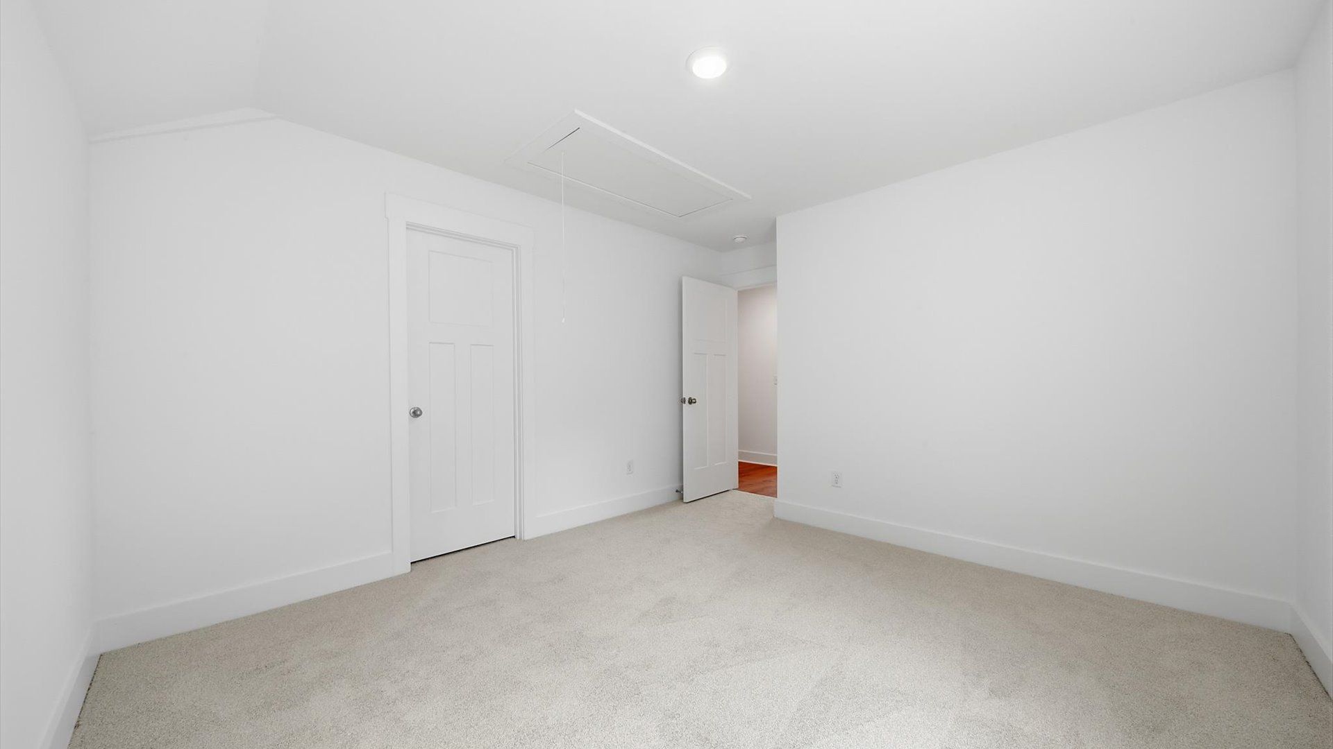 First-class secondary bedroom with comfortable carpeted flooring and generous closet space