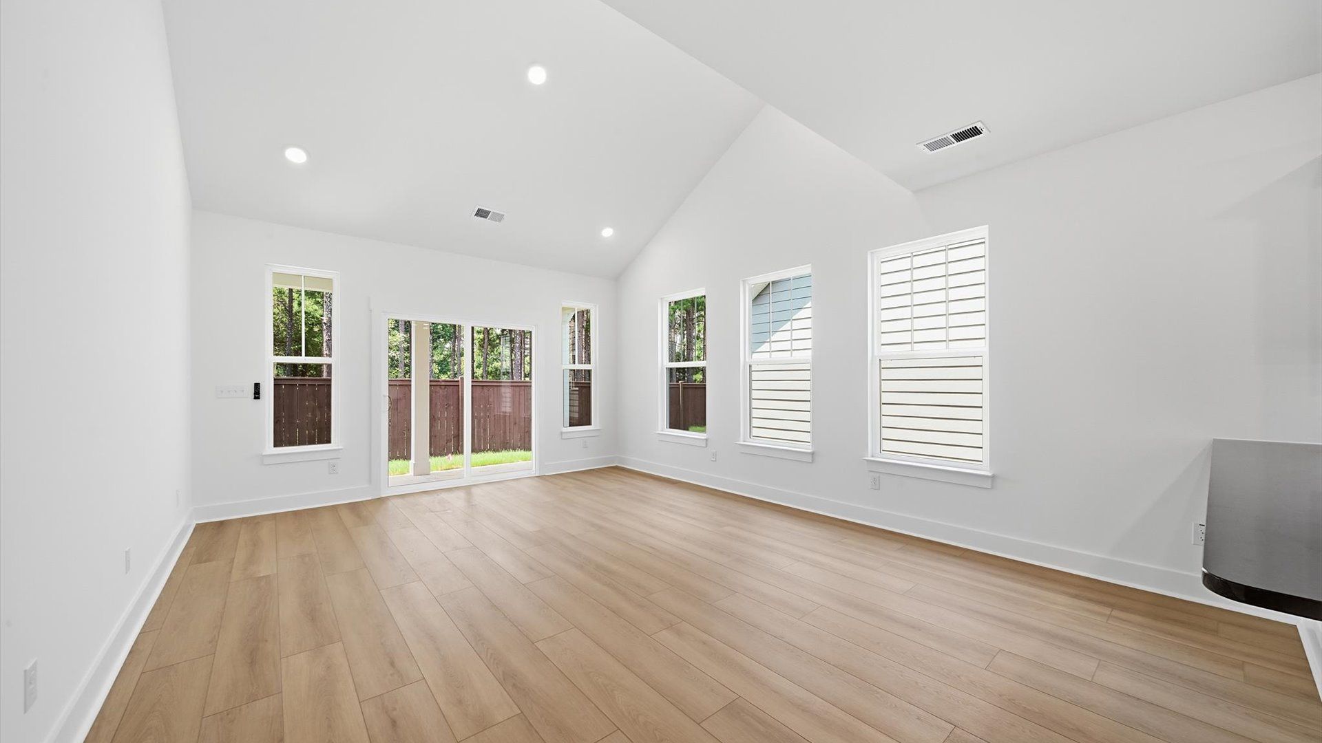 First-rate family room with eye-catching two-story ceilings and superior architectural detail