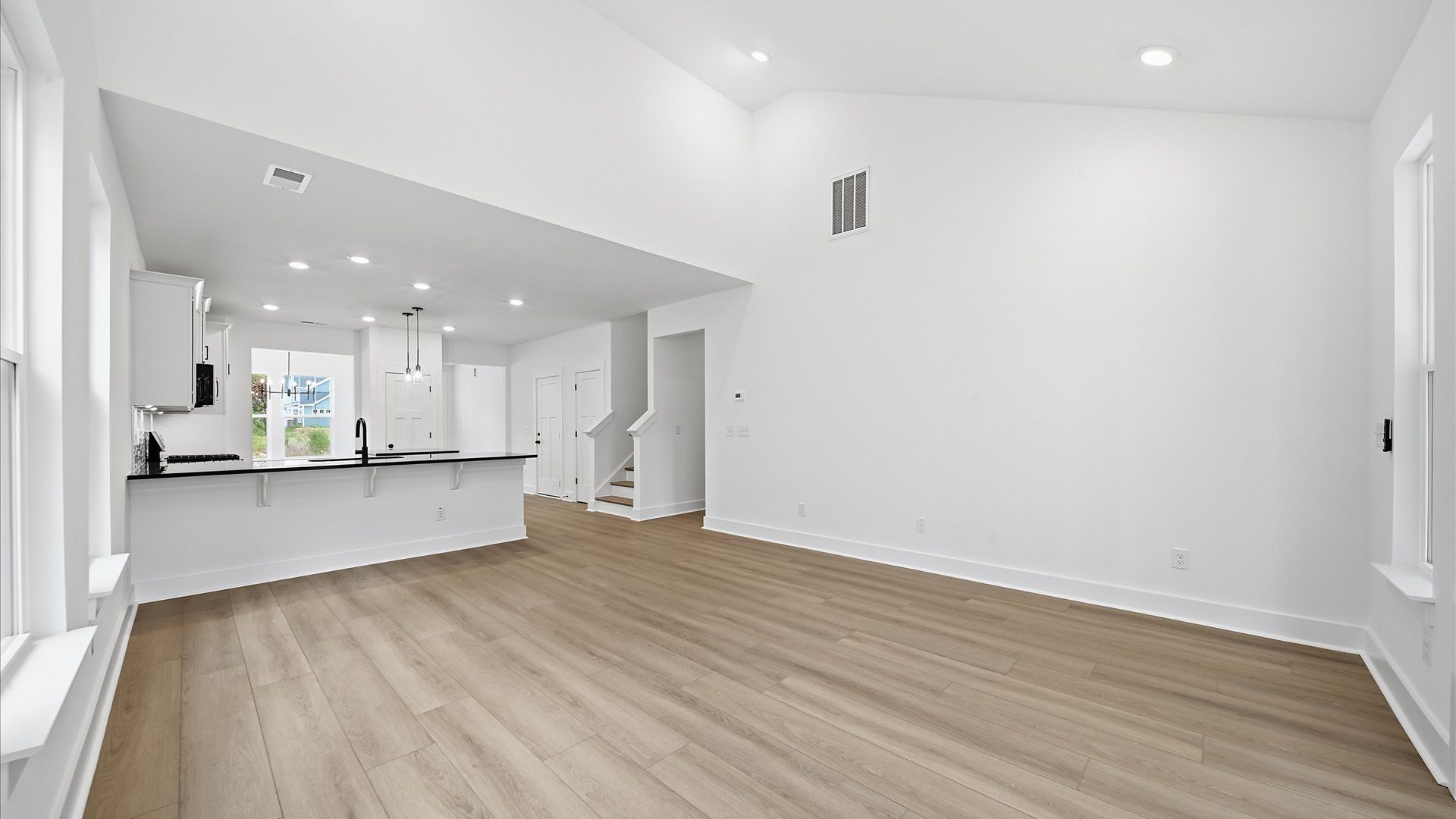 Exclusive living space with towering ceilings, tasteful finishes, and a warm, welcoming feel