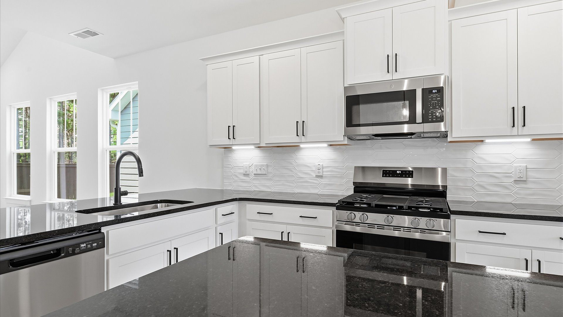 Highly functional kitchen offering a refined look and practical island at the center