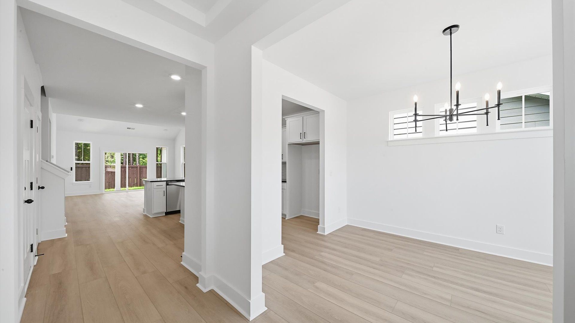 Exceptional foyer with warm hardwood flooring and refined finishes throughout