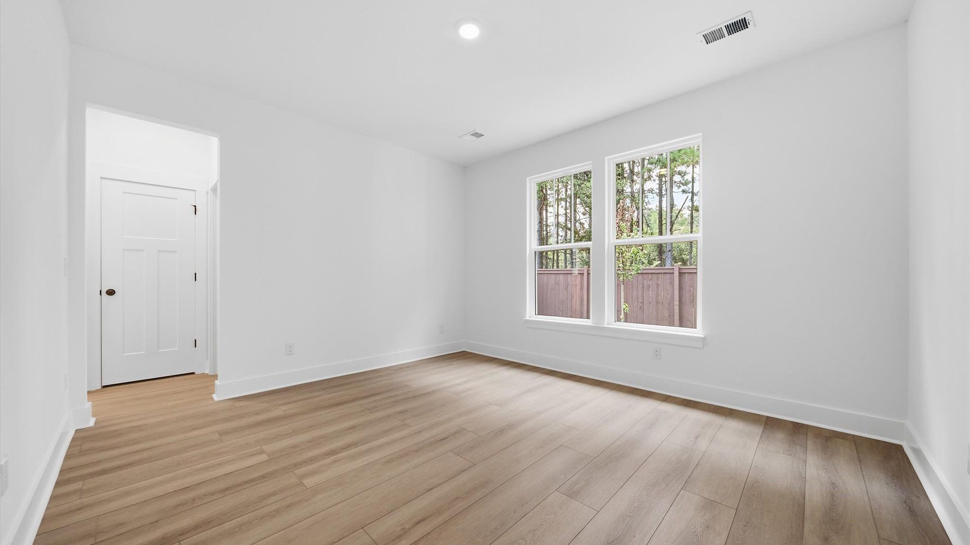 Superior layout with private, modern main level primary suite with LVP flooring in this leading DRB Homes design