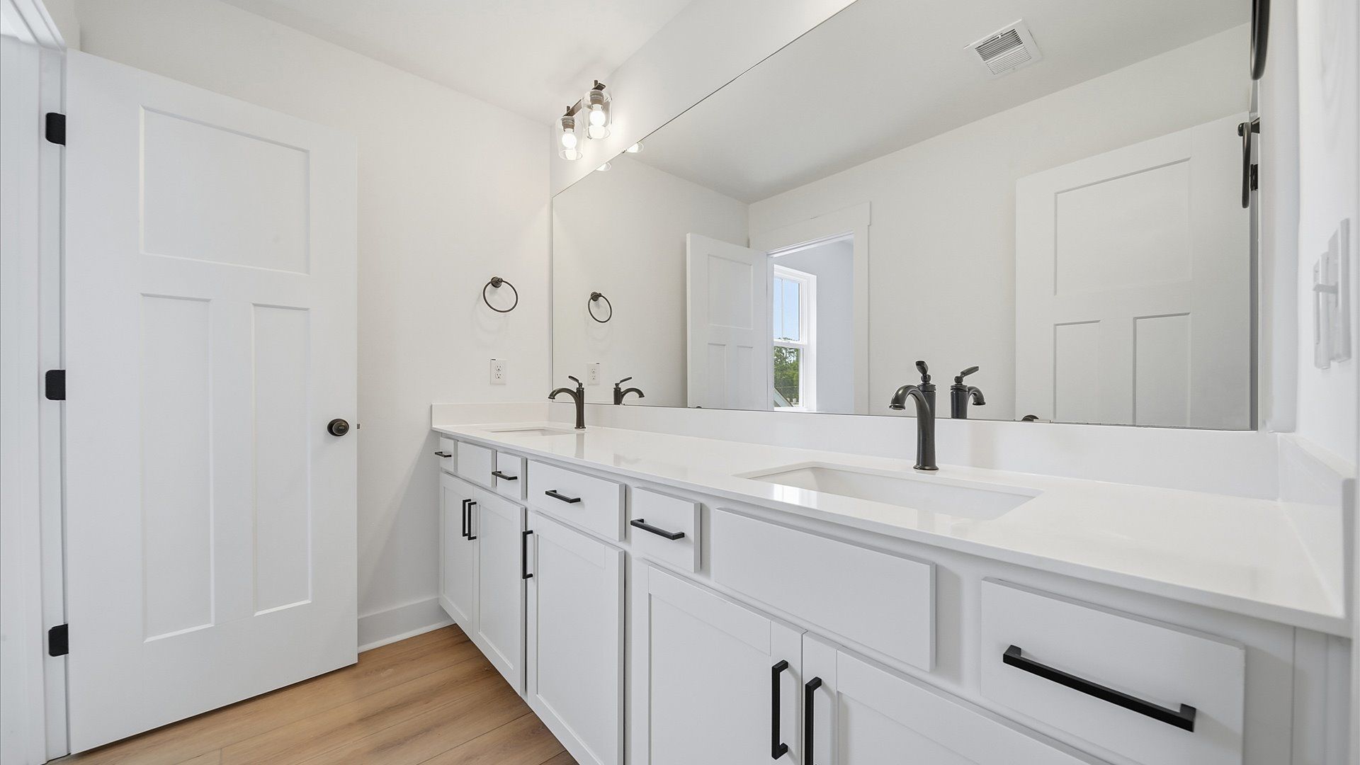 Vibrant and welcoming bathroom with elegant countertop space and polished details