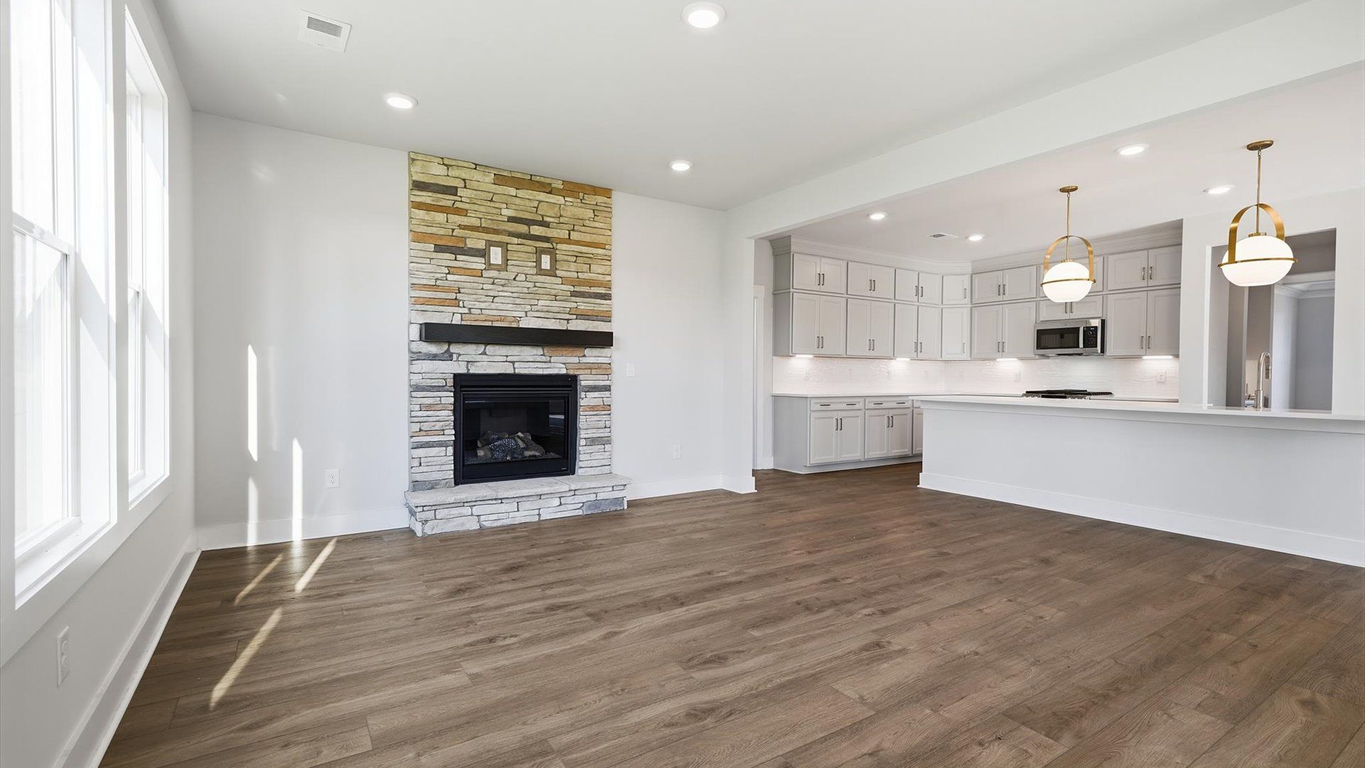 Vibrant and welcoming family room anchored by clean lines, tasteful materials, and abundant light