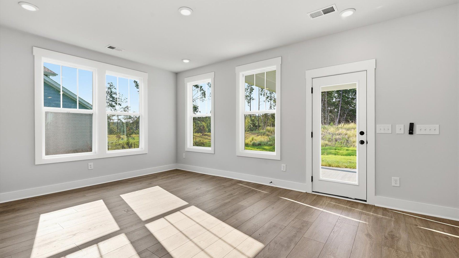 Inviting breakfast nook filled with natural light in this thoughtfully designed home