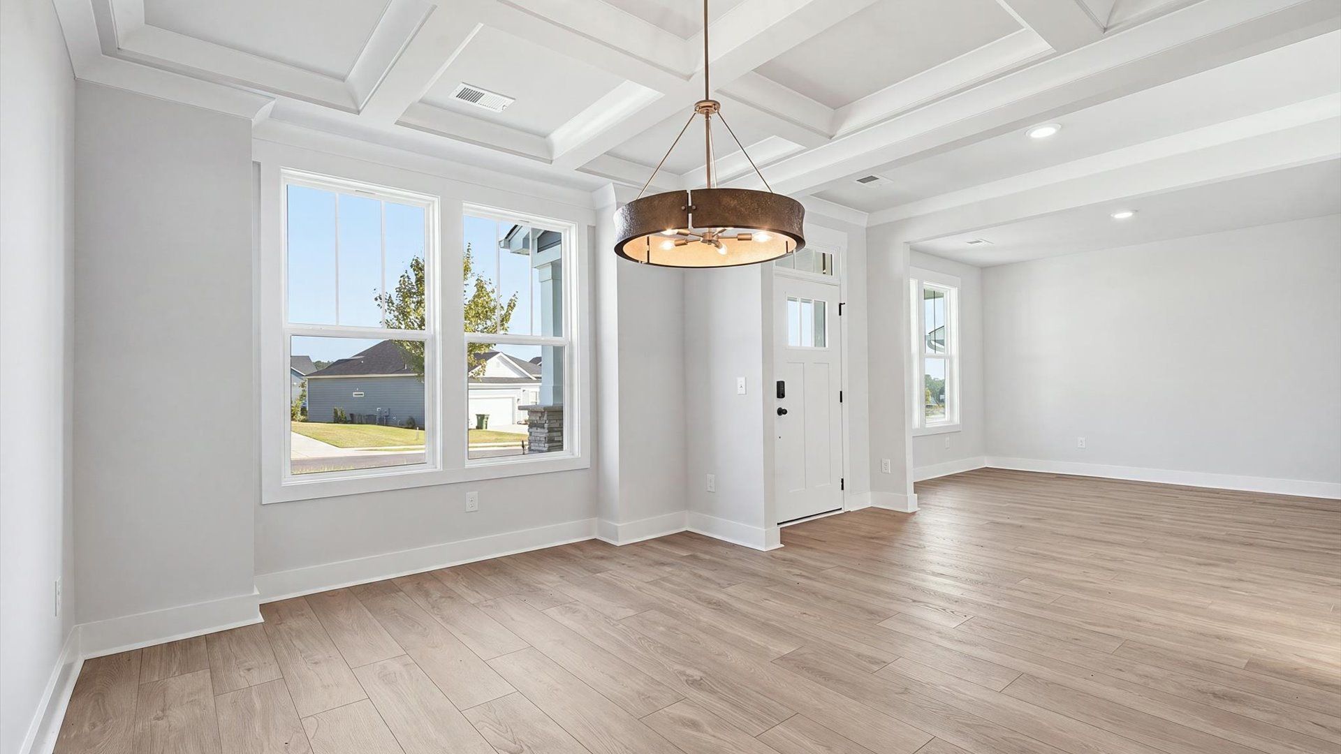 Superior craftsmanship seen in every corner—especially the coffered ceiling of this elegant dining space
