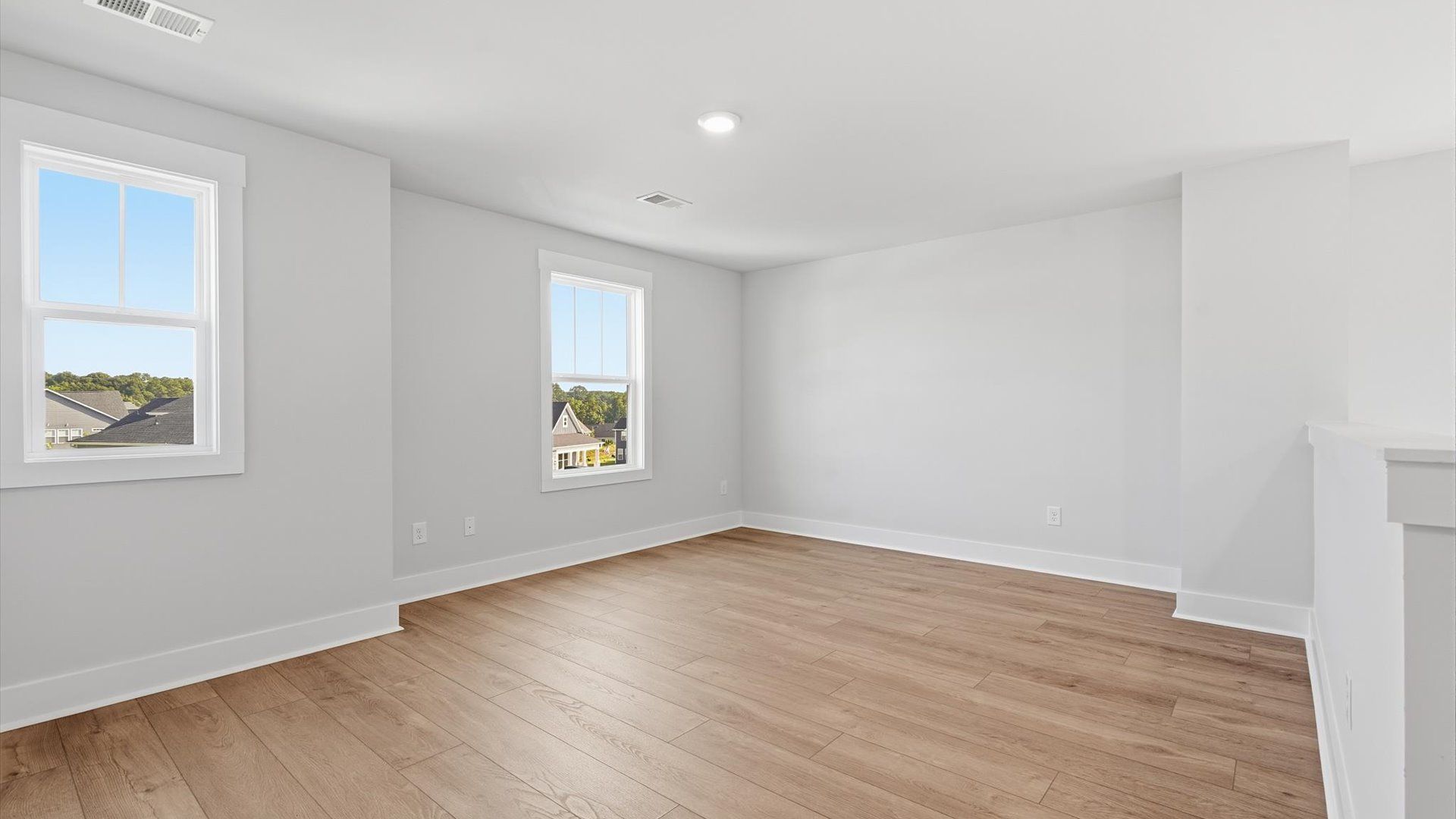 Beautiful hardwood flooring creates a polished and inviting loft