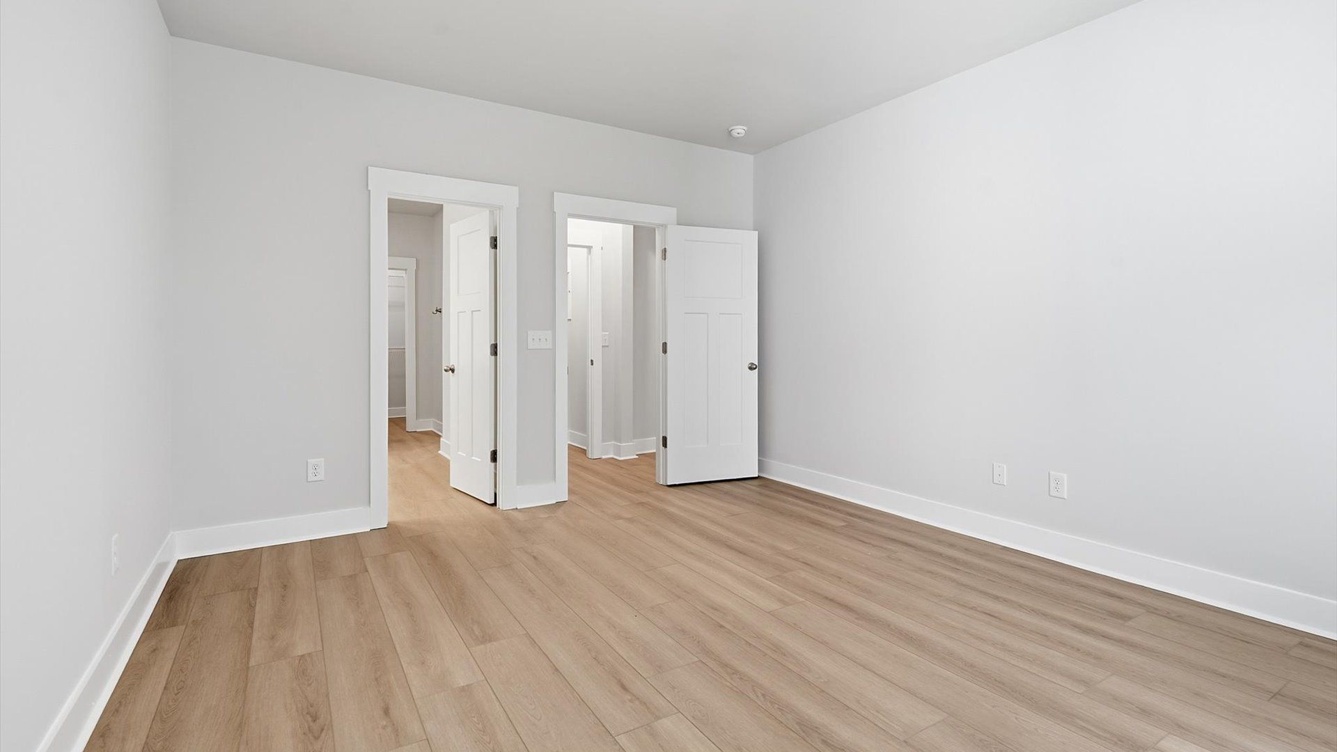 First-class hardwood floors and tasteful finishes elevate the private retreat of this exceptional primary suite