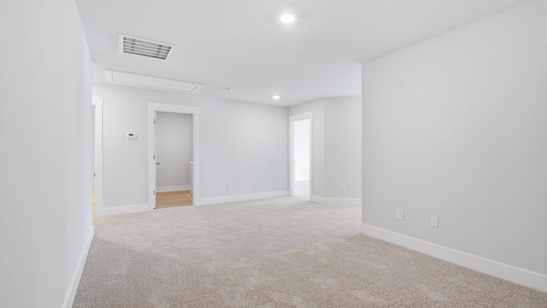Accomplished upstairs loft with plush carpet and versatile functionality