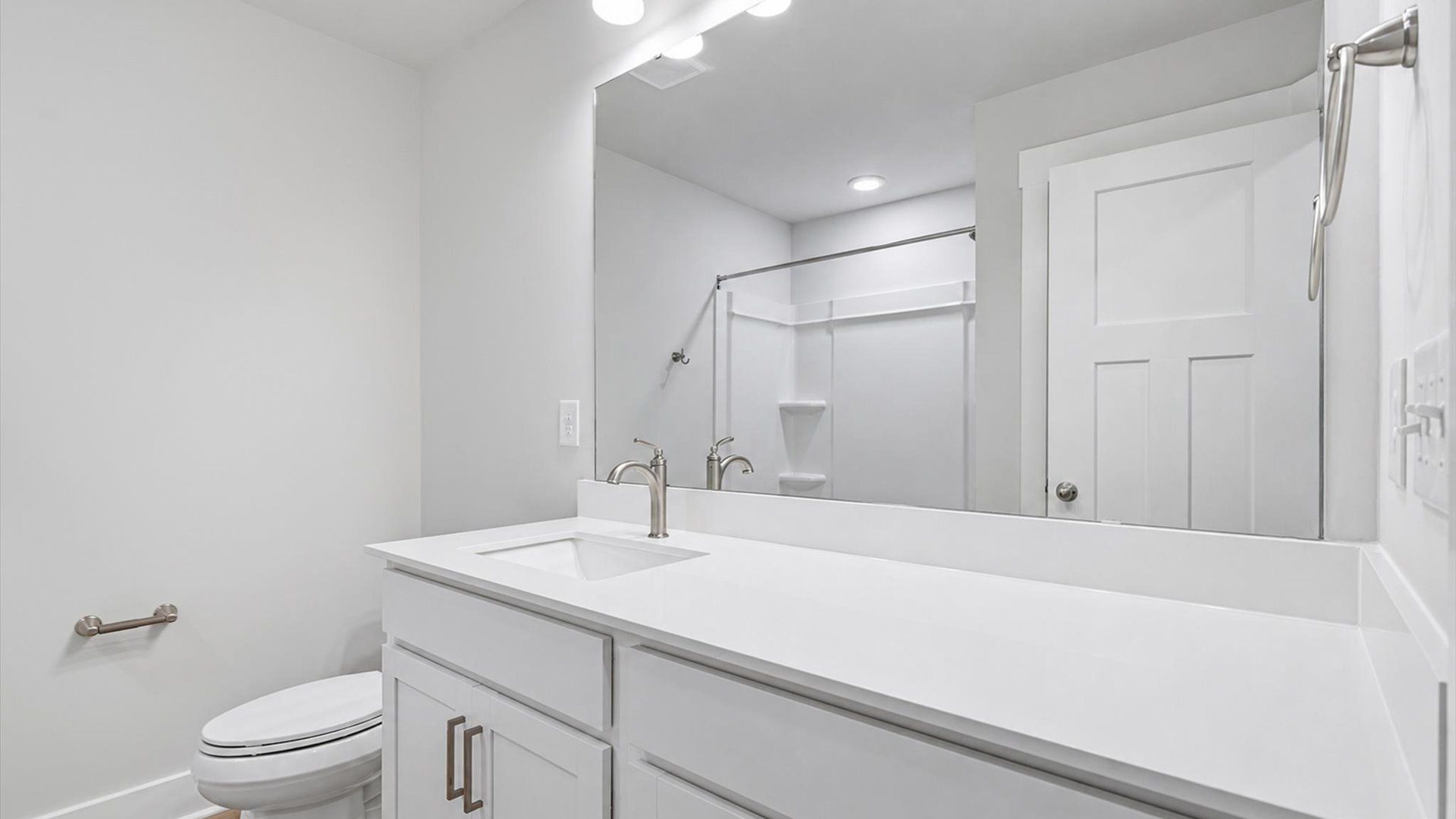 Highly skilled design seen in this polished and practical full bathroom