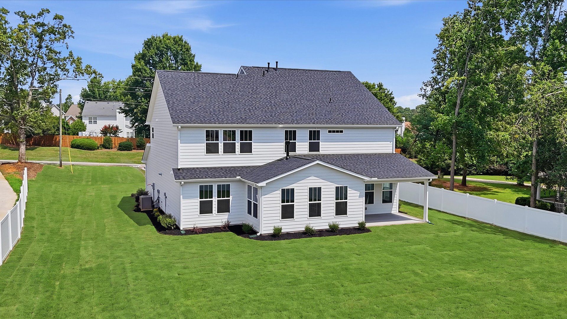 Highly functional rear covered porch adds memorable living space to this elegant home at Pelham Crossing