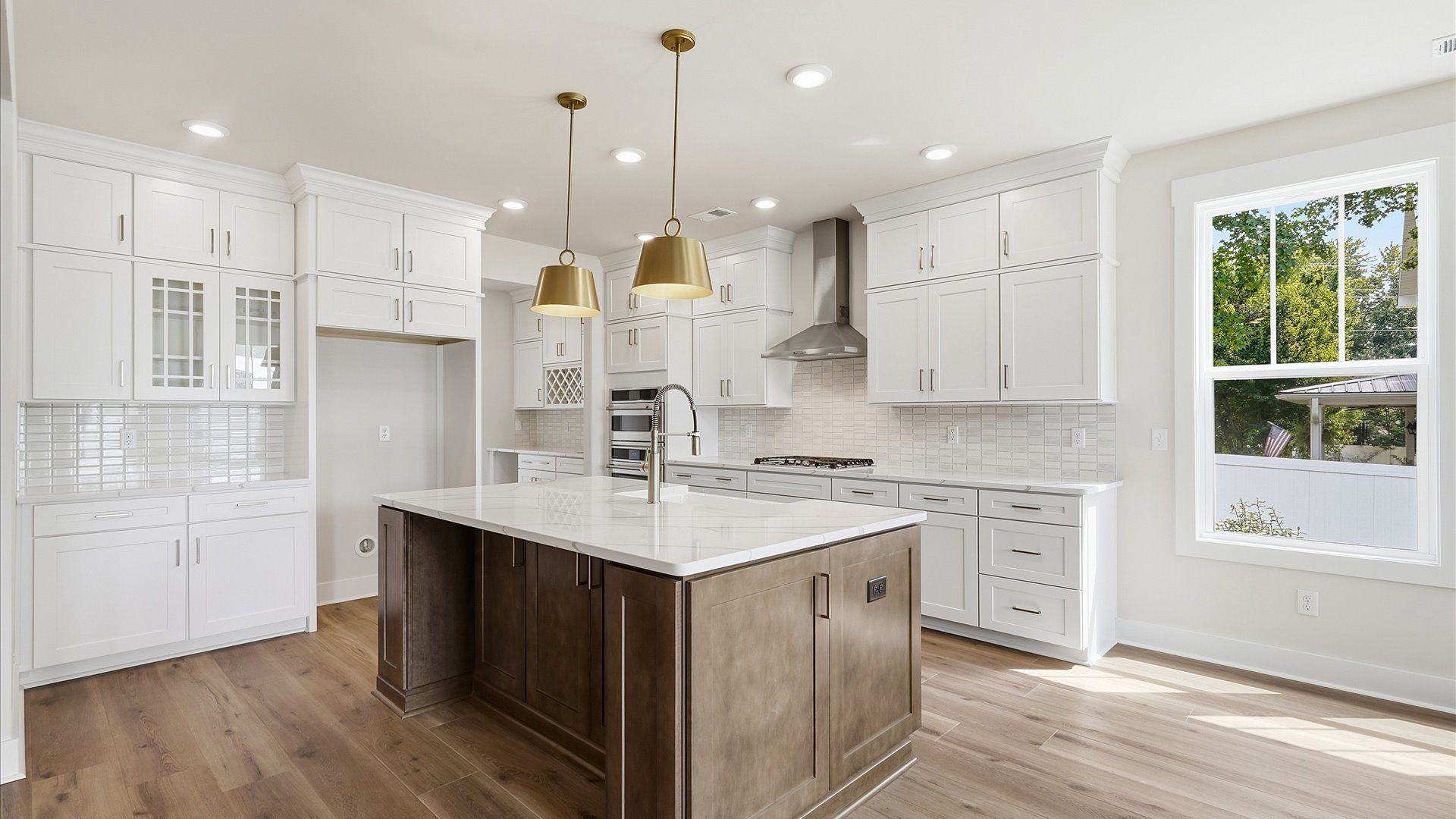 Notable 9-foot island provides generous prep and gathering space in this thoughtfully designed kitchen