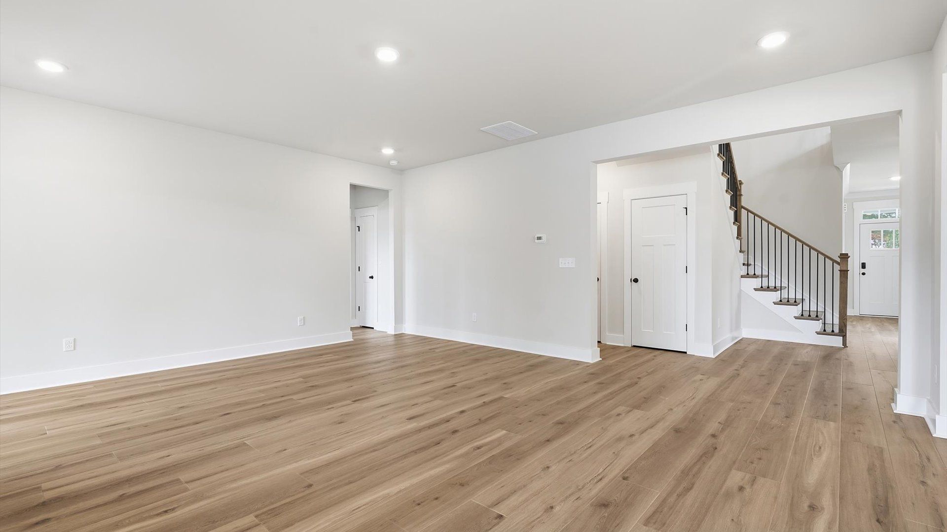 Exceptional family room with hardwood flooring in this exclusive Greenville-area home