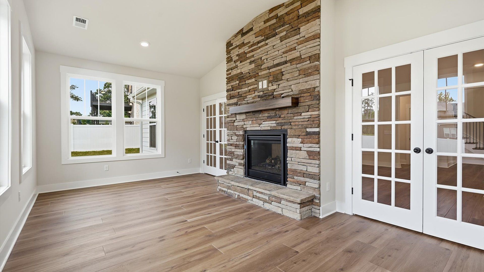 Exclusive morning room with tasteful touches, natural light, and a vibrant open feel at Pelham Crossing