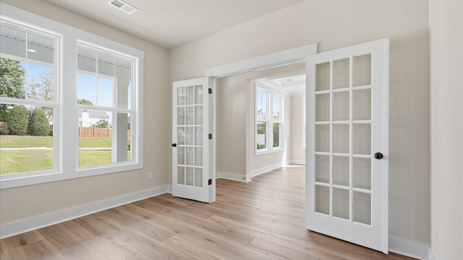 Notable study with French doors and elevated design for both productivity and style