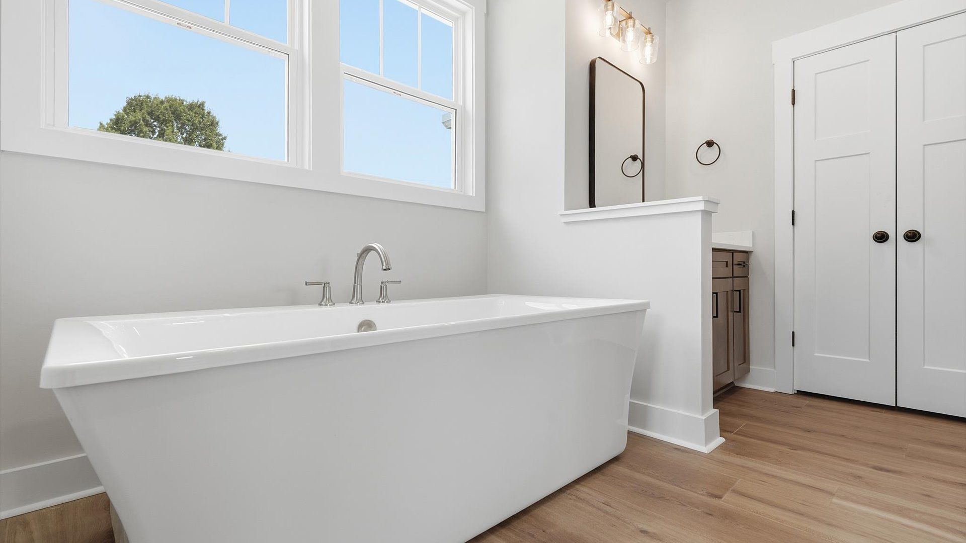 Discover everyday elegance with a luxurious soaking tub and spacious layout