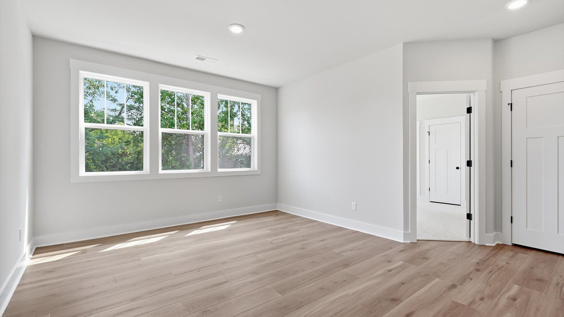 Hardwood flooring enhances the versatility of this elegant upper-level loft space