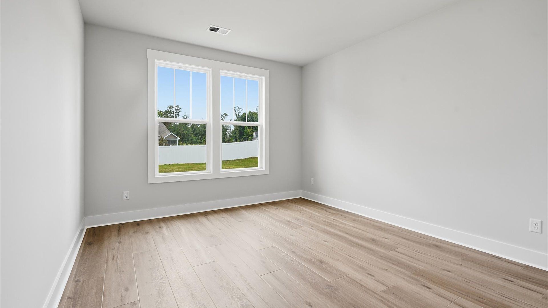 Hardwood flooring adds warmth to this inviting main-level guest retreat