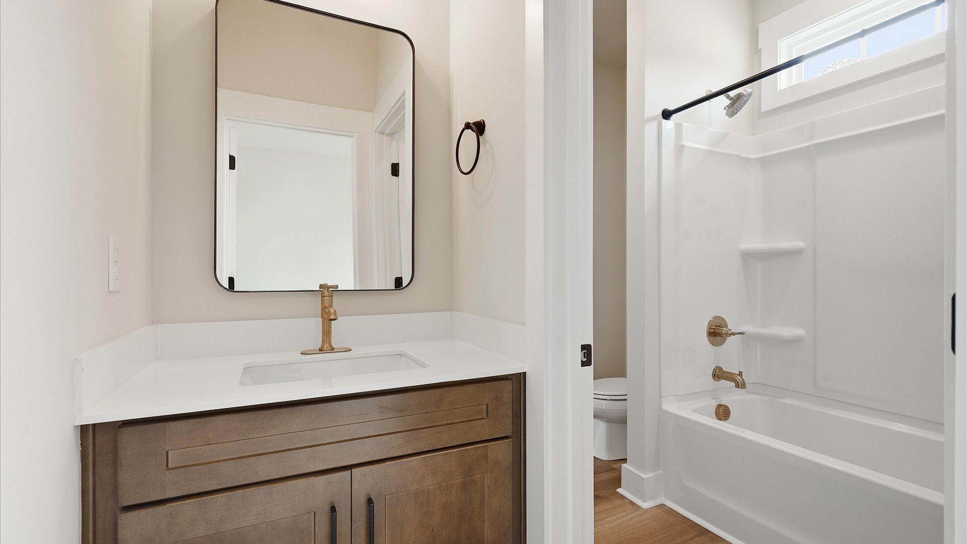 Elegant bath retreat with designer finishes and a clean, timeless aesthetic