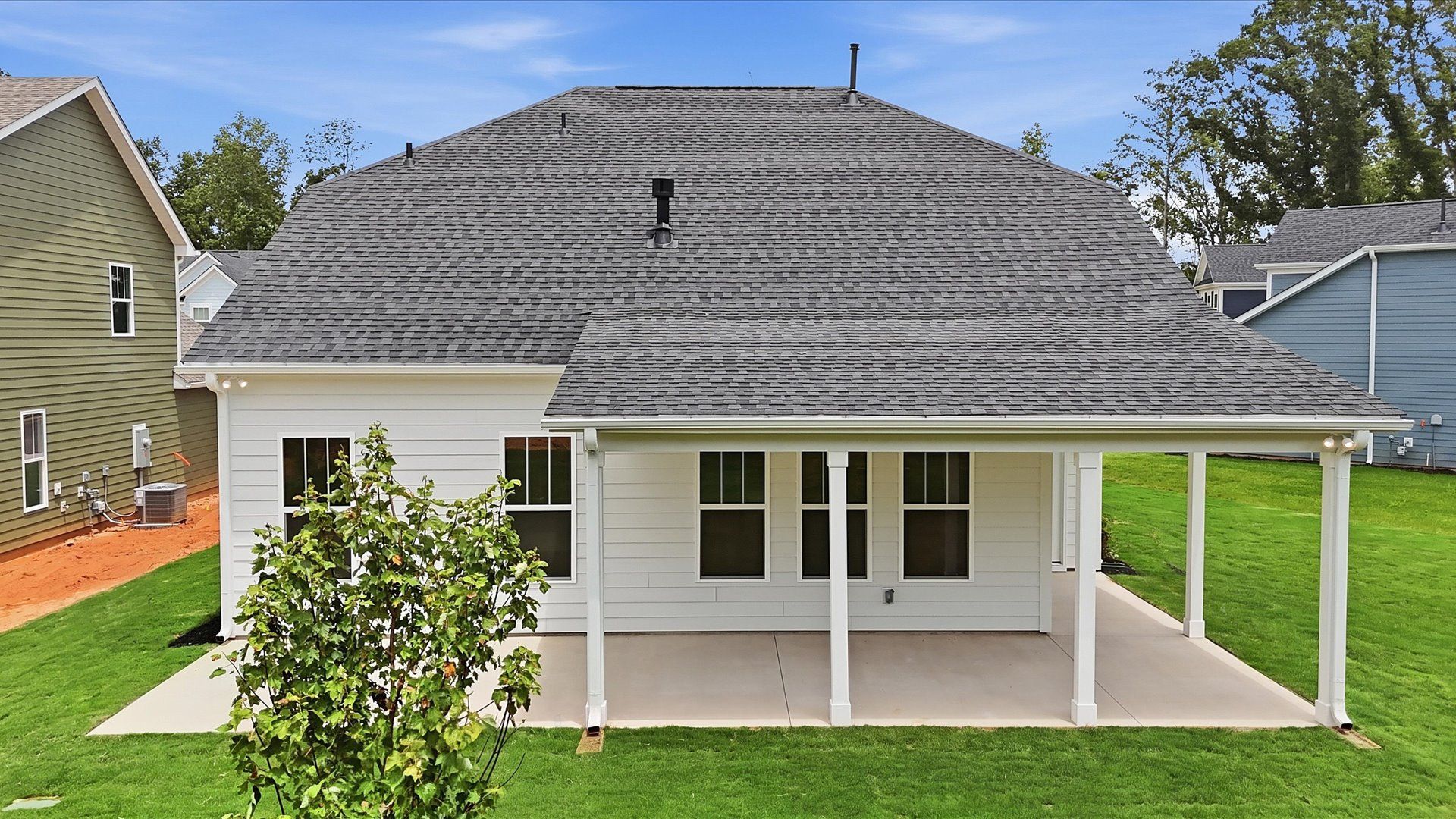 Established charm meets functional outdoor living with a spacious rear covered porch at Creeks at Midway