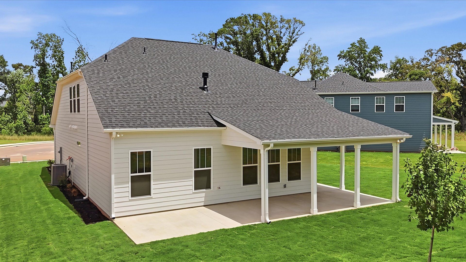 Vibrant rear outdoor space featuring a covered porch and exceptional craftsmanship near Downtown Anderson