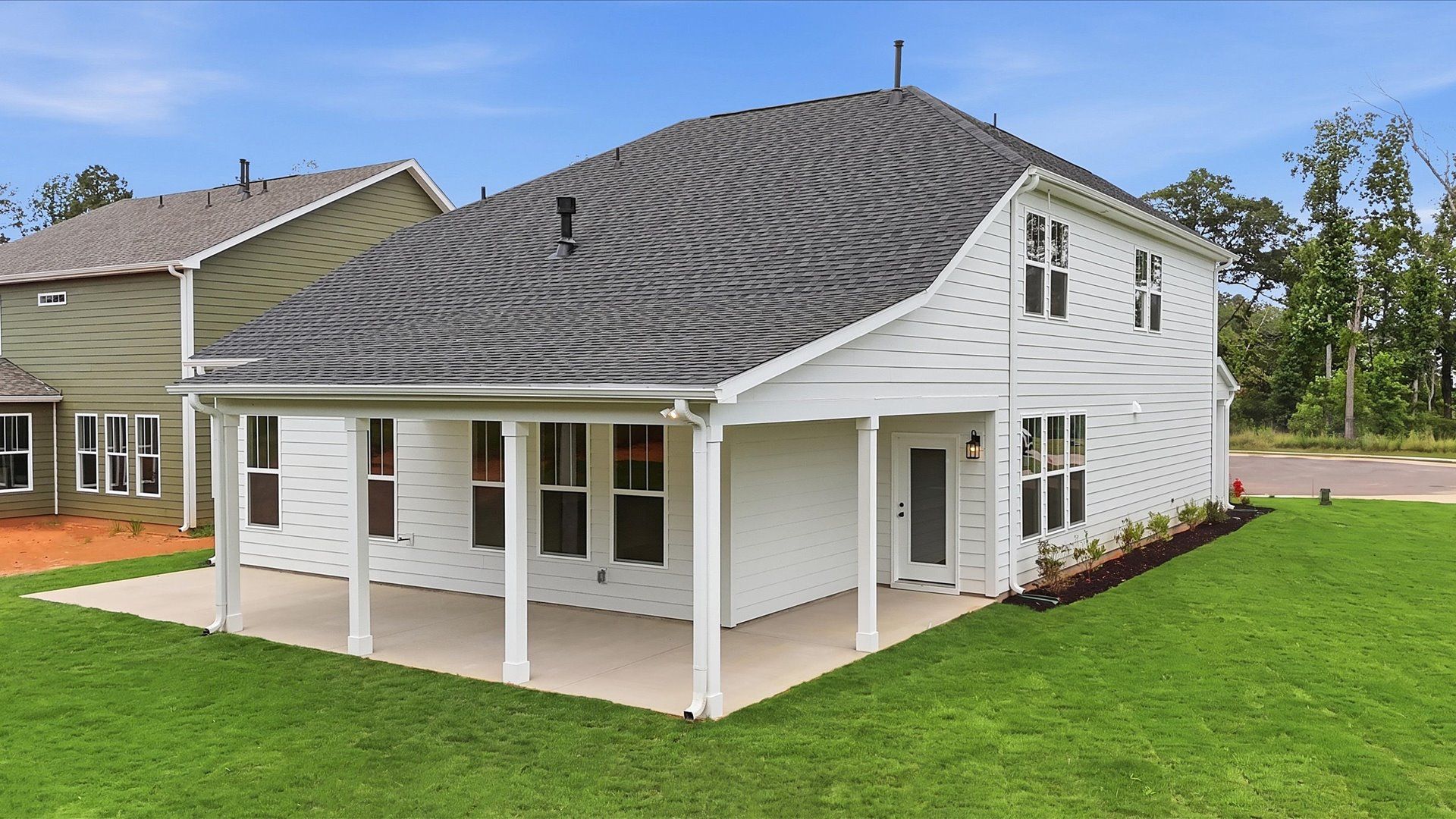 Highly functional rear covered porch adds memorable living space to this elegant home located in Anderson, SC