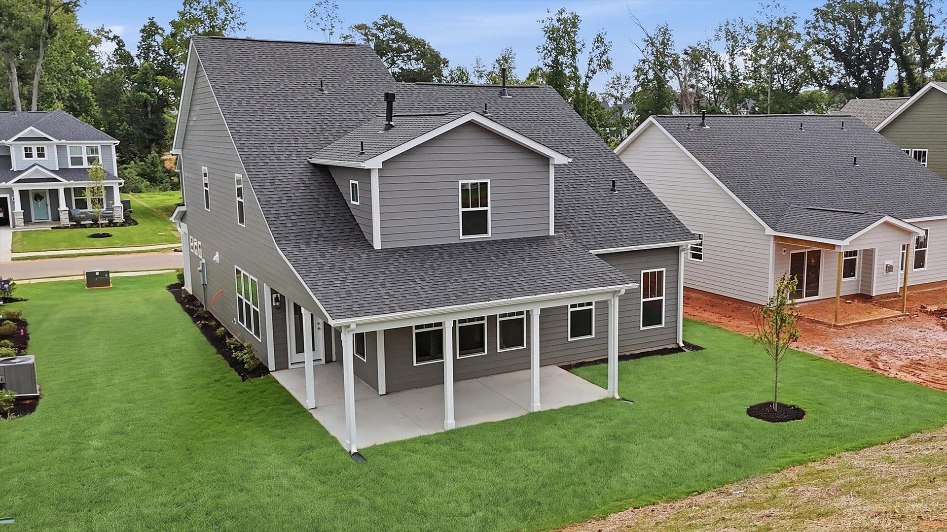 Accomplished exterior with a spacious rear porch that blends comfort and style