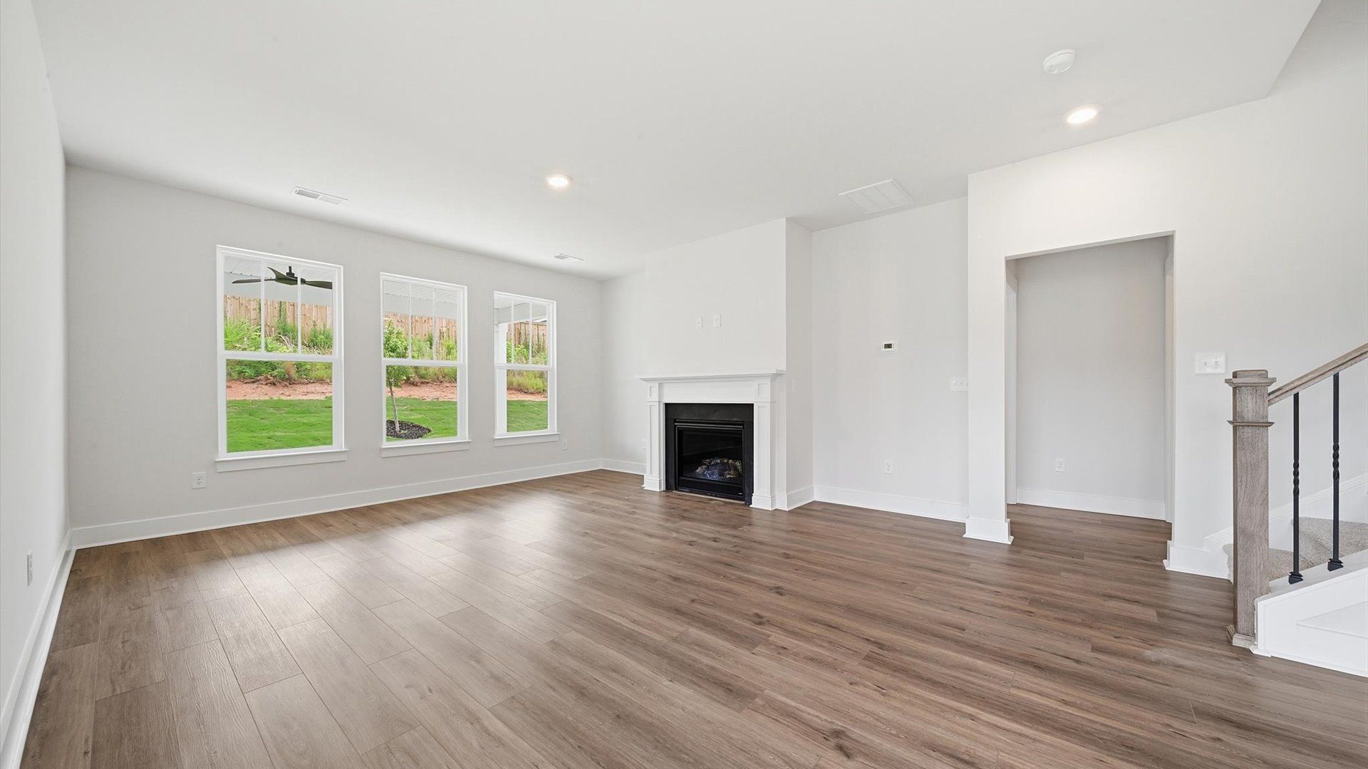 Hardwood flooring and high standards define this vibrant family room ideal for everyday living near Downtown Anderson