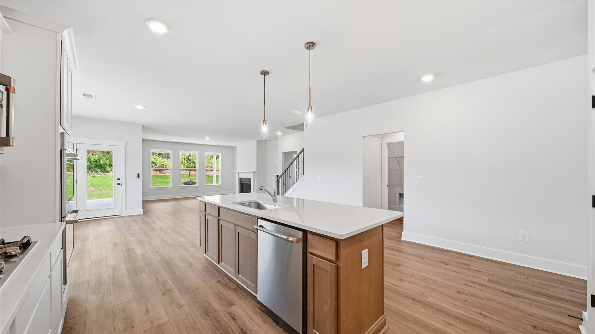 Exceptional culinary space with a striking 9-foot island and eye-catching pendant lights at Creeks at Midway