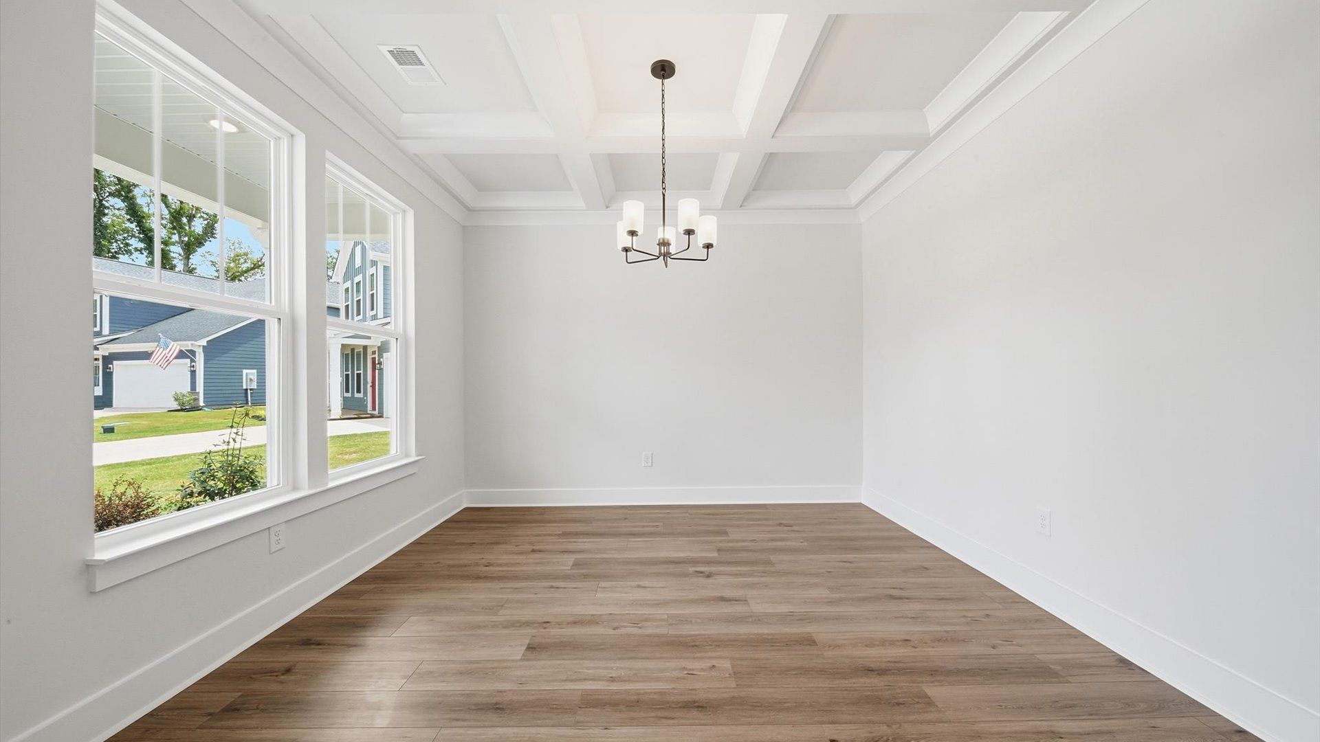 Thoughtful design meets architectural elegance in this coffered ceiling dining room near Lake Hartwell