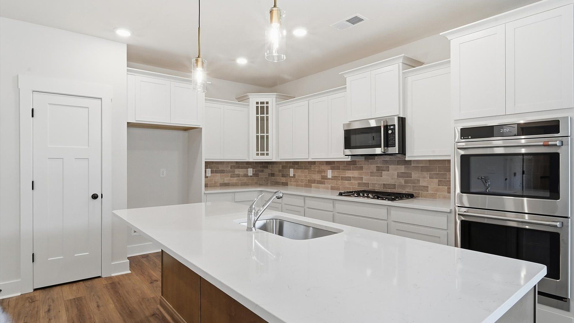 Beautifully appointed kitchen with spacious counters and sophisticated detailing by DRB Homes