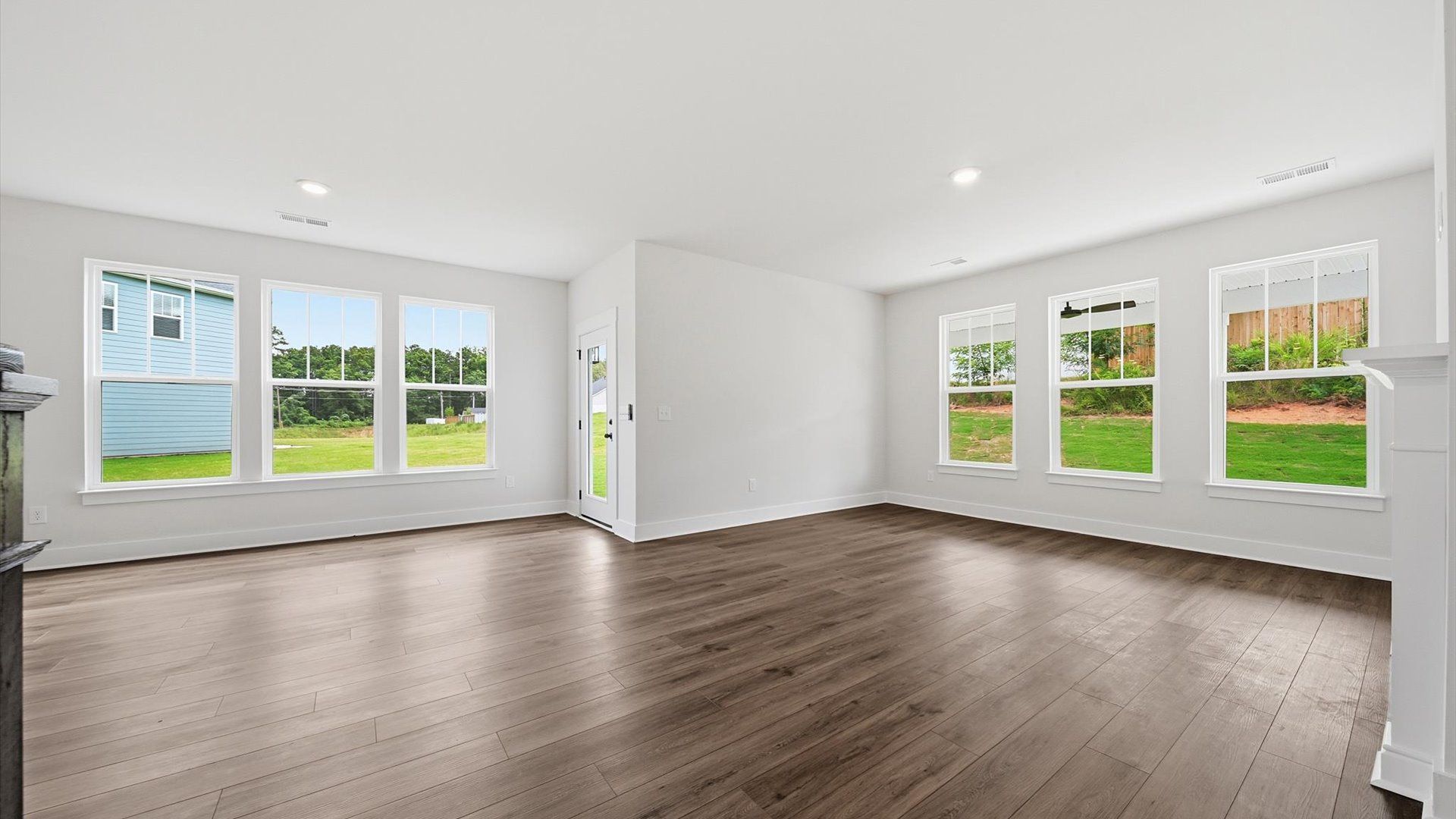 Refined and memorable, this family room features high ceilings and top-notch comfort throughout at Creeks at Midway