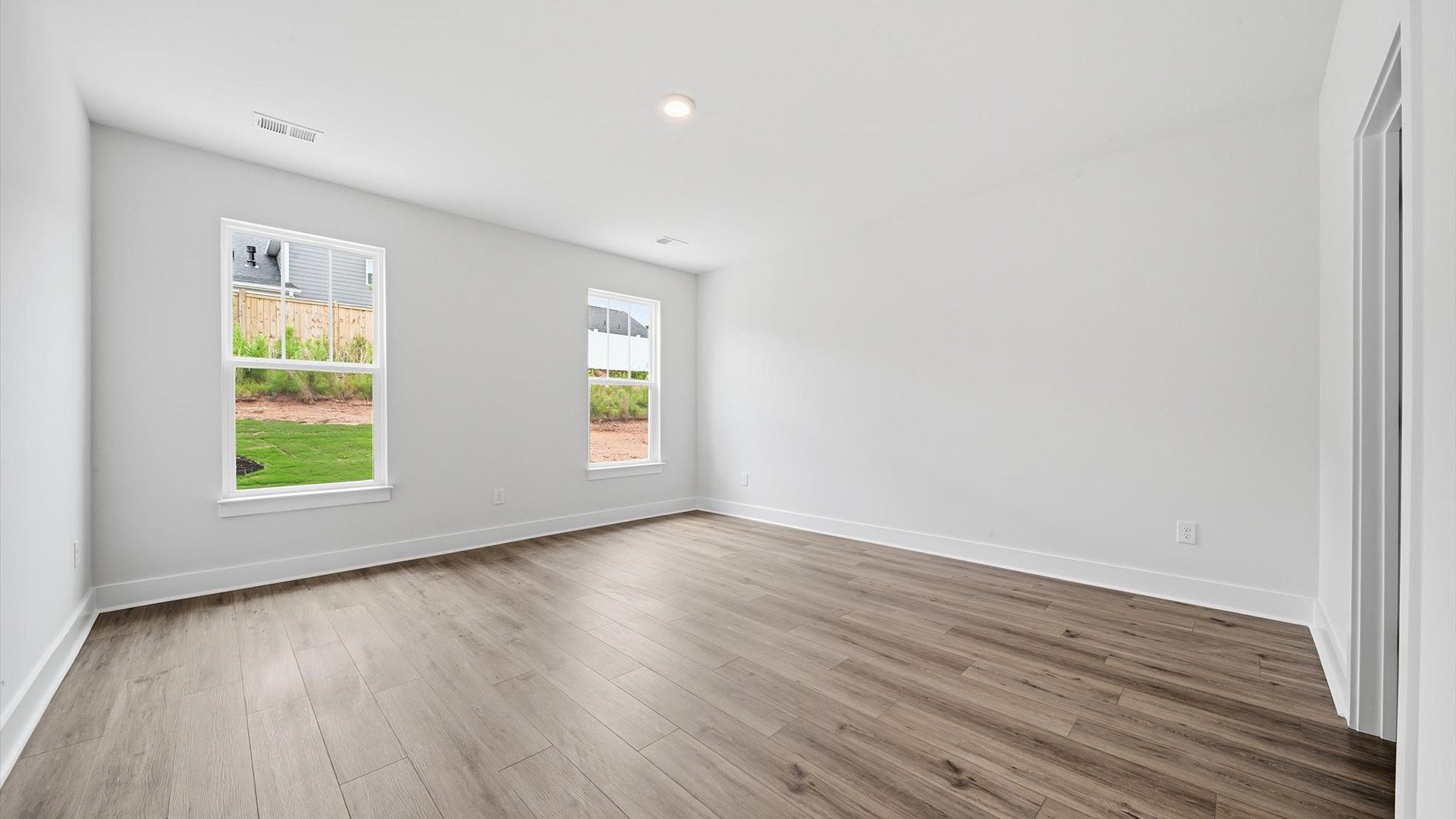Primary suite that offers first-rate relaxation with established style and elevated finishes by DRB Homes