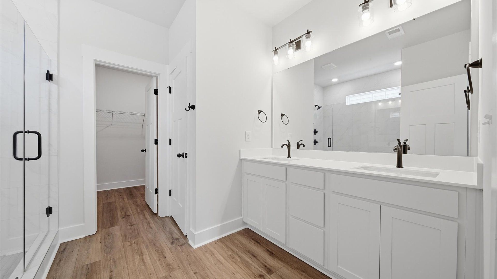 Notable primary suite with dual vanities and walk-in shower in this prime Anderson home