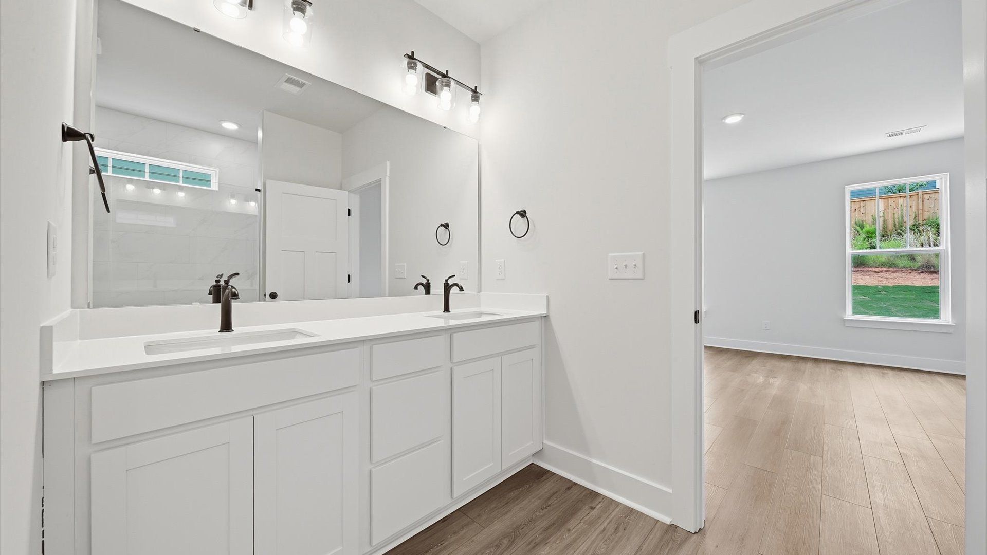 Superior en-suite primary bathroom with stylish dual vanity and walk-in shower—crafted with high standards in mind in SC