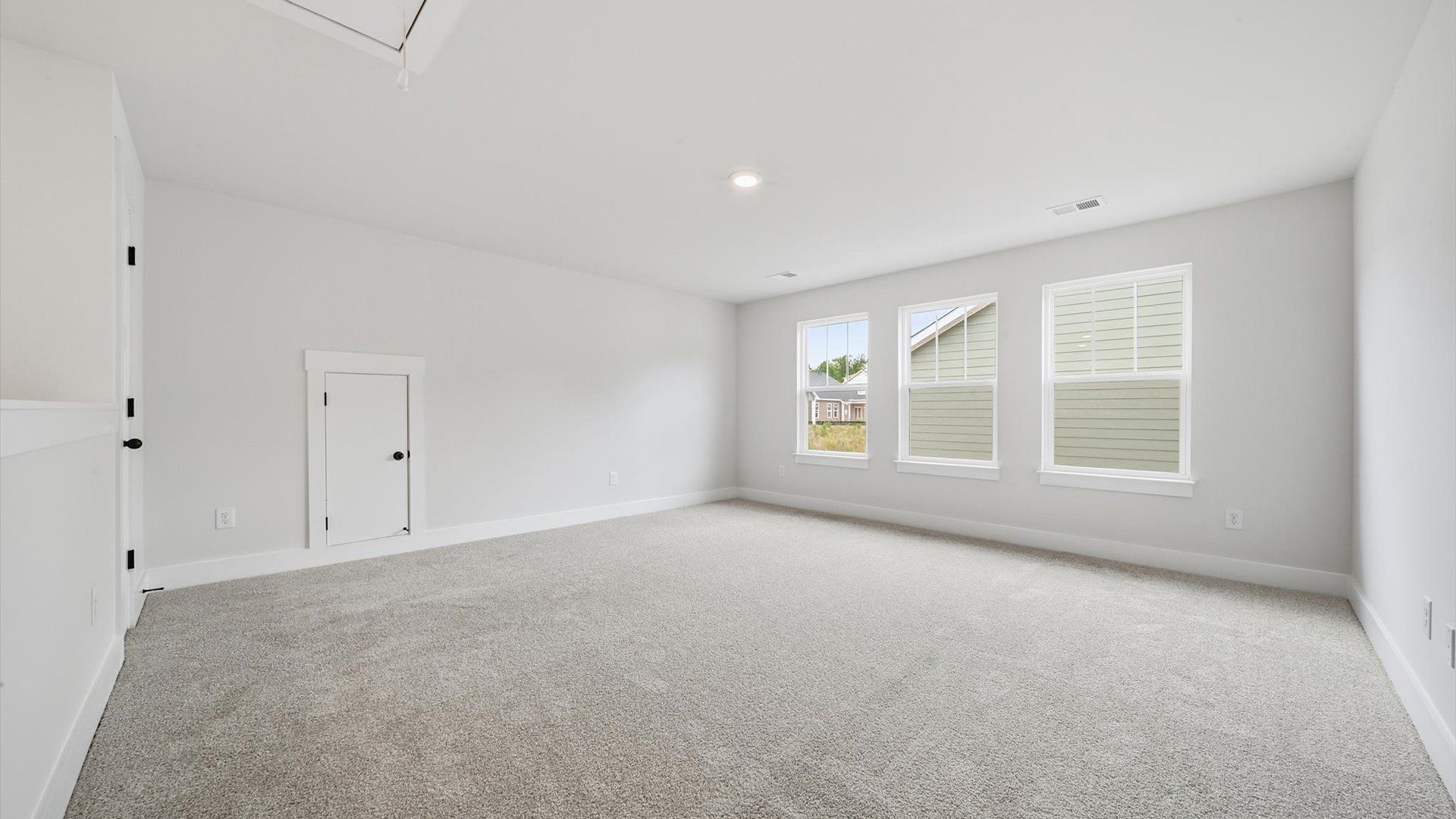 Stylish loft retreat with carpeted flooring and accomplished architectural detail at the Creeks at Midway community