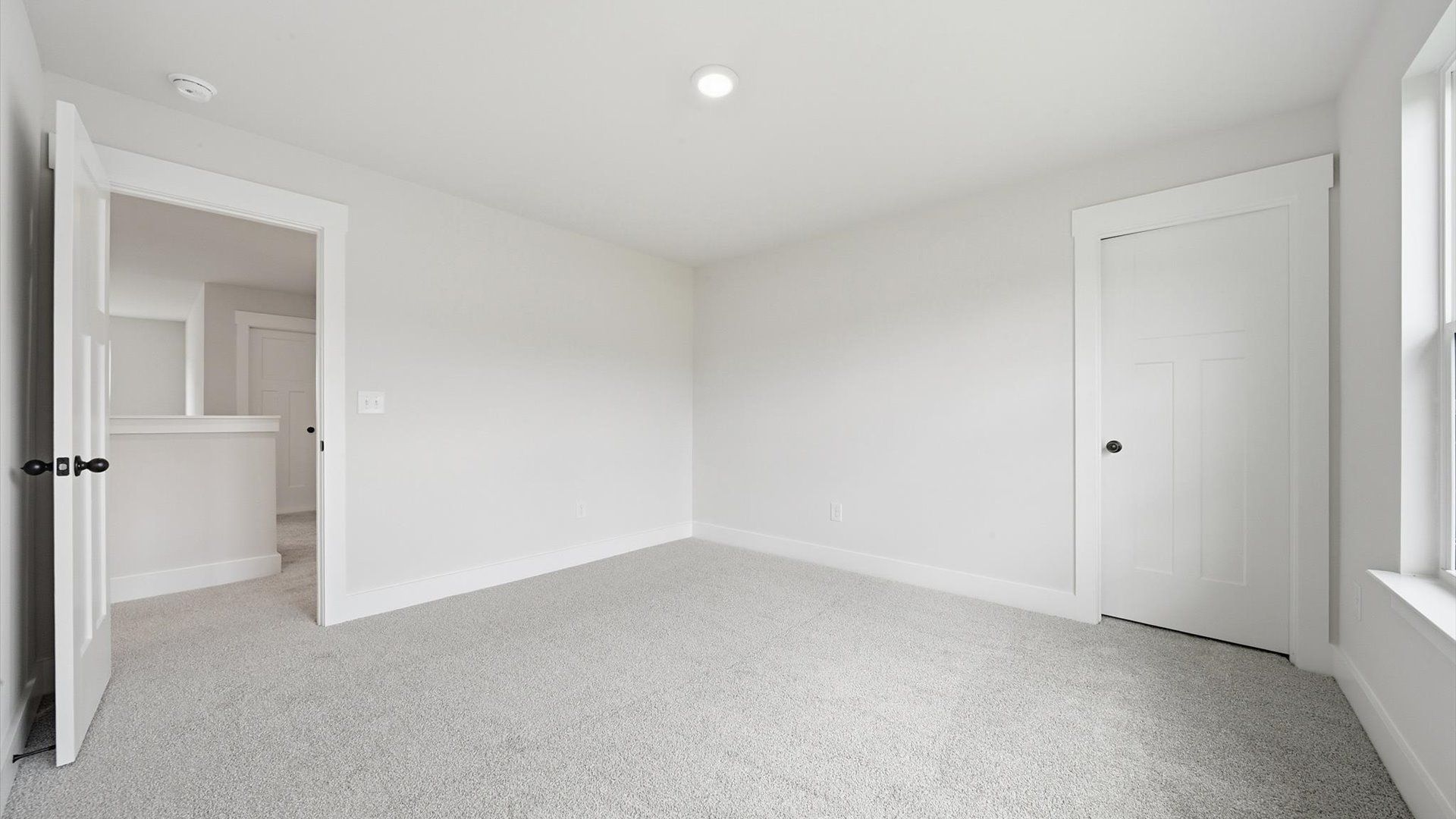 Superior comfort in a secondary bedroom with plush carpet and an oversized walk-in closet at Creeks at Midway