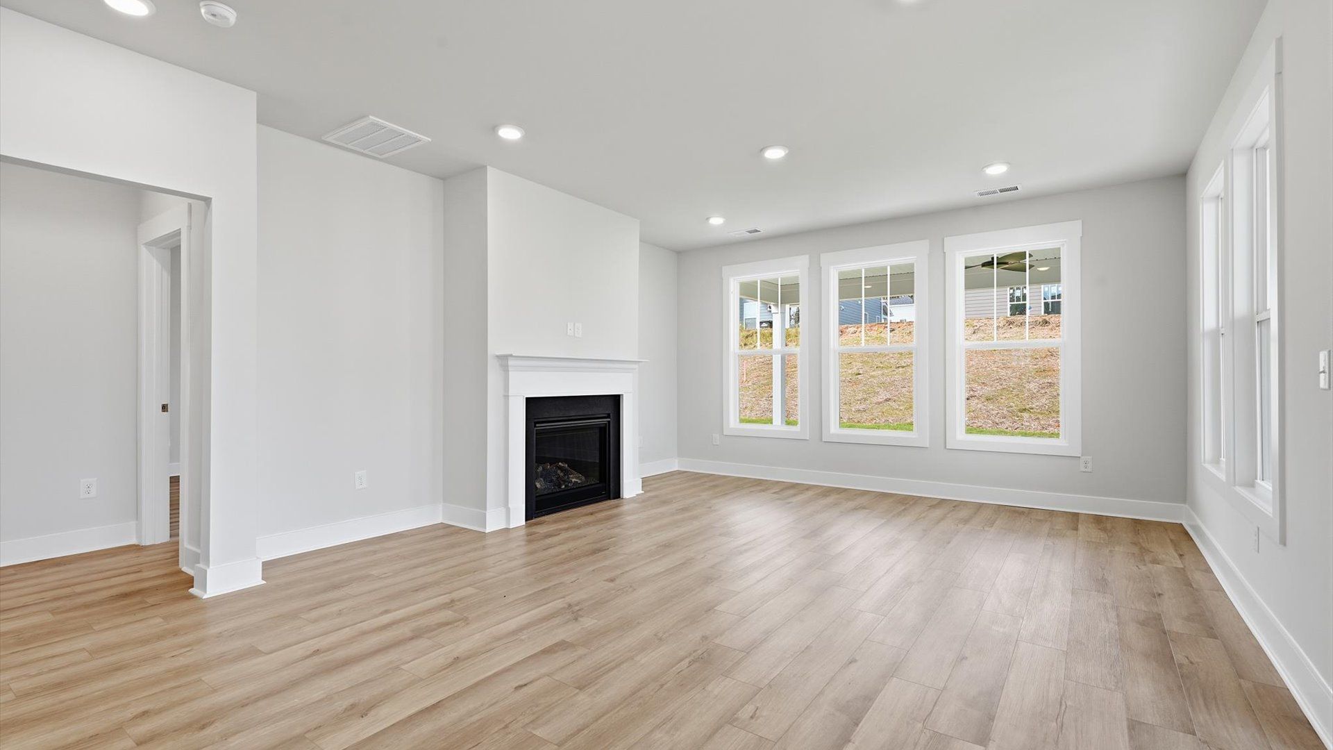 Spacious family room with accomplished design and eye-catching details throughout
