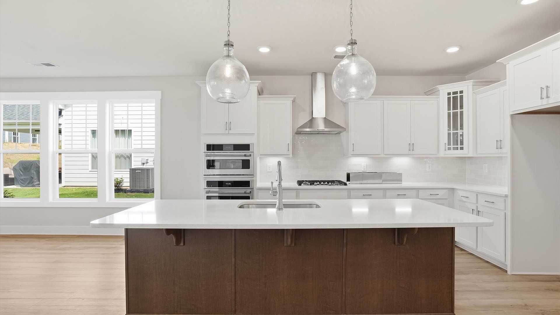 Luxury kitchen featuring a 30-inch range hood and premium cooking appliances