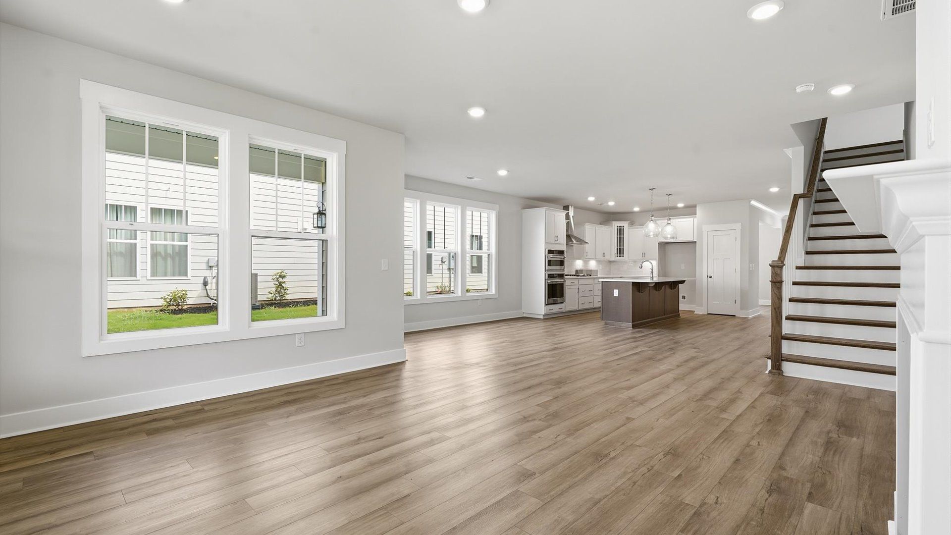 Exceptional family room featuring fireplace, tasteful finishes, and vibrant natural light near Downtown Anderson