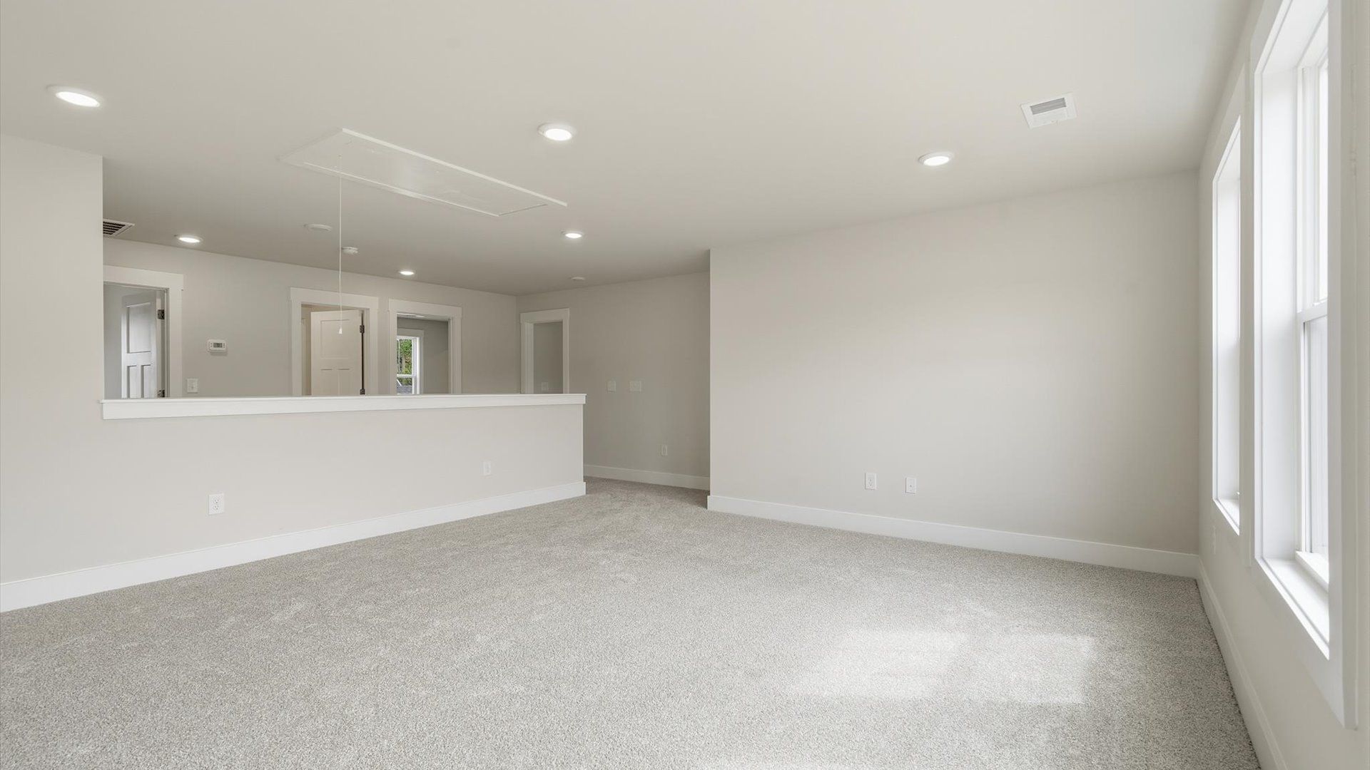 Memorable upstairs loft with plush carpeting and a bright, welcoming atmosphere