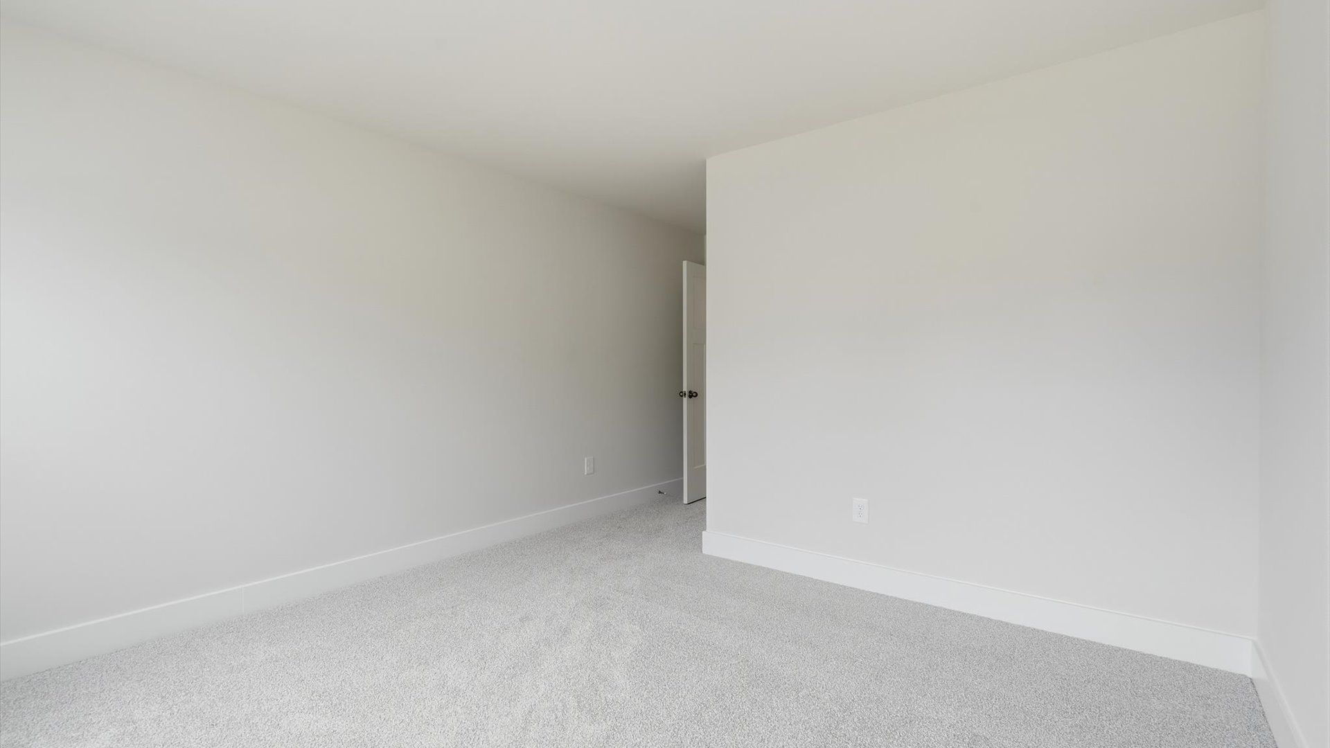 First-rate bedroom with plush carpeting and large windows that provide an open, airy feel