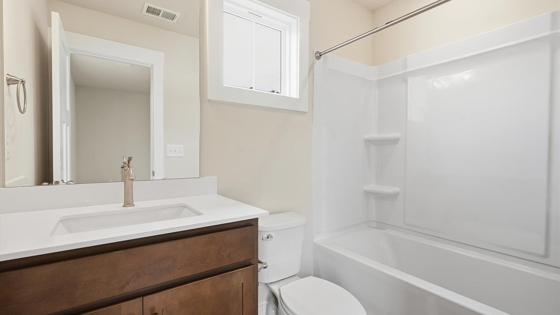 Notable full bathroom offering tasteful details and a bright, functional space
