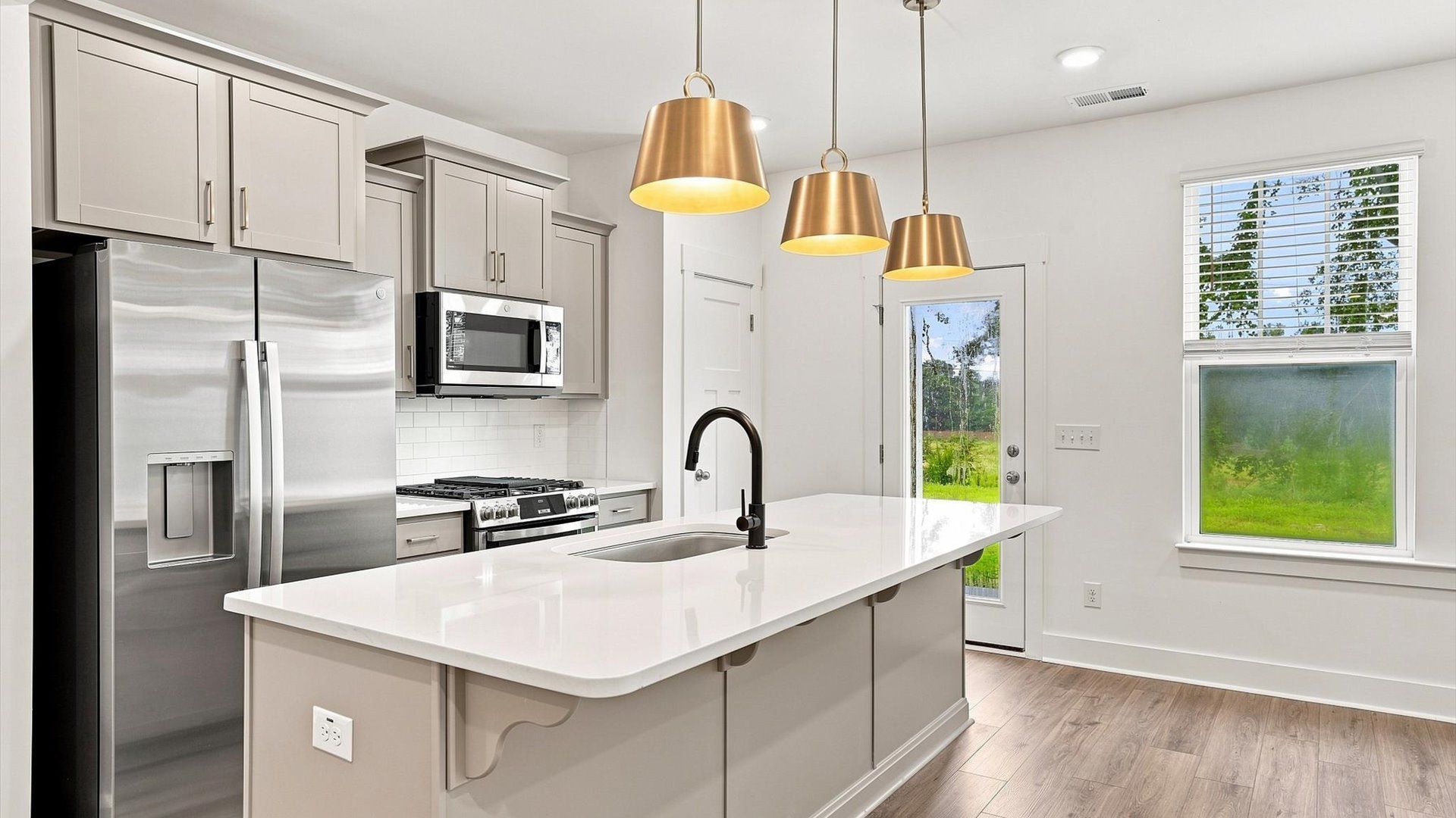 Accomplished layout with a first-class kitchen in this select villa community by DRB Homes